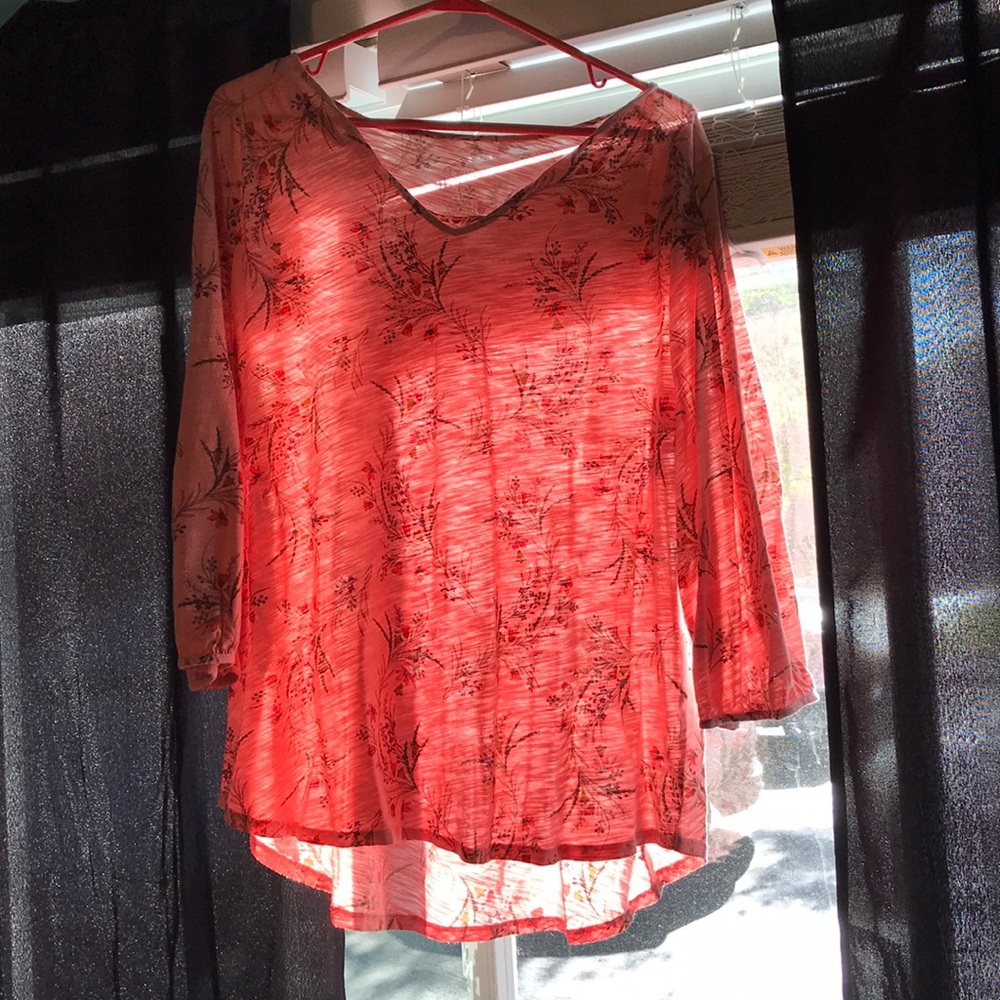 Pink floral blouse.